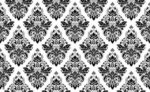 Wallpaper in the style of Baroque. Seamless vector background. White and black floral ornament. Graphic pattern for fabric, wallpaper, packaging. Ornate Damask flower ornament