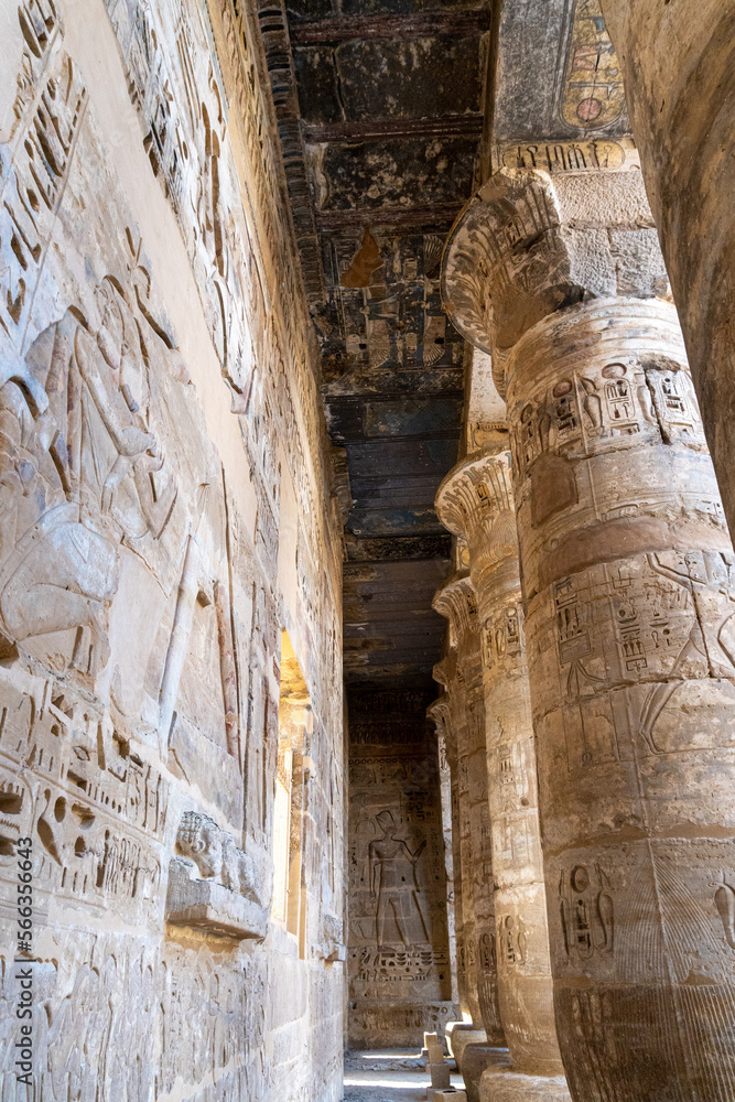 Interior of the temple of Ramses III, full of columns with drawings and hieroglyphs Interior of the temple of Ramses III, full of columns with drawings and hieroglyphs