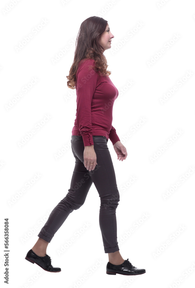 in full growth. happy young woman striding forward in full growth. happy young woman striding forward