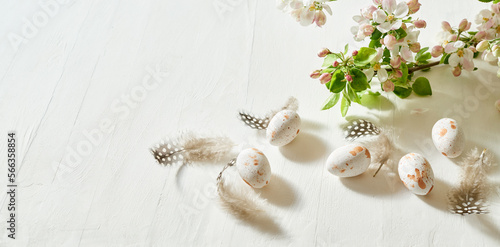 Holiday composition with spring flowers and easter eggs on a light background. Happy easter concept with copy space