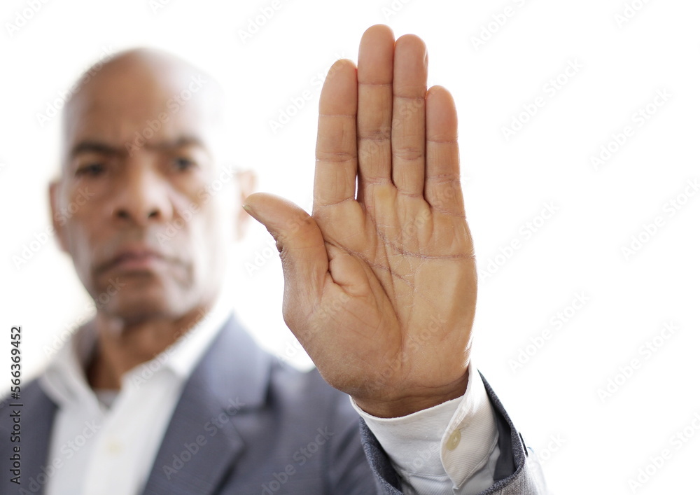 black man holding hand up saying stop on white background stock photo black man holding hand up saying stop on white background stock photo