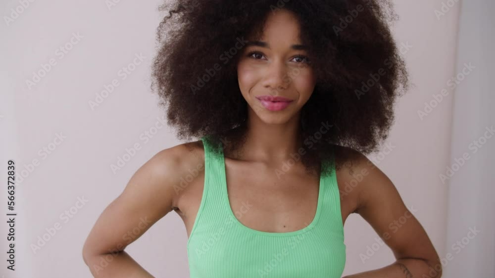 Young cheerful woman posing in studio. Young cheerful woman posing in studio.
