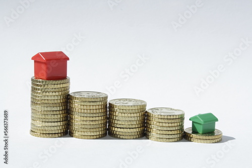coins and red and green house