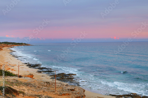Sunset sky clouds over the sea in Apulia, Italy. Beautiful sunlight in the sea. Amazing nature landscape seascape Colorful sky clouds background. 