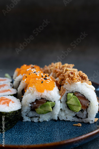 Sushi roll sushi with shrimp, avocado, red caviar , sesame. Sushi menu. Japanese food