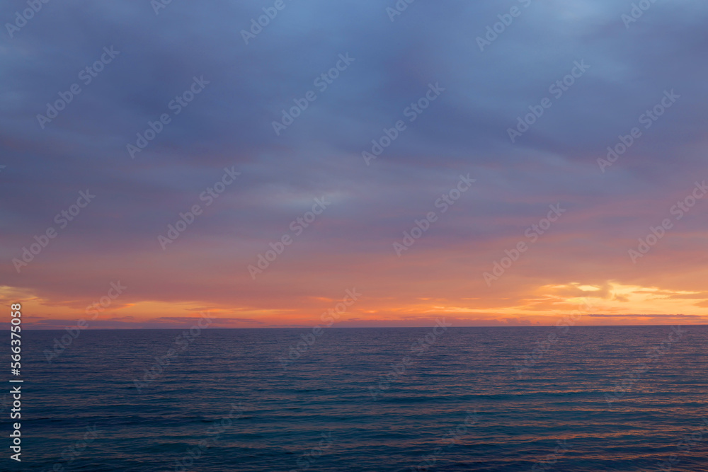 Sunset sky clouds over the sea in Apulia, Italy. Beautiful sunlight in the sea. Amazing nature landscape seascape Colorful sky clouds background.
