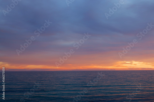 Sunset sky clouds over the sea in Apulia, Italy. Beautiful sunlight in the sea. Amazing nature landscape seascape Colorful sky clouds background.