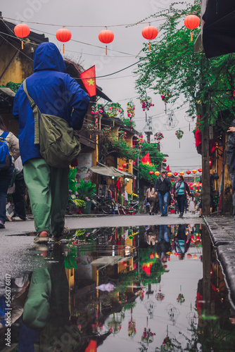 low angle street view of people walking in Hoi An- Vietnam travel - solo travel vibes