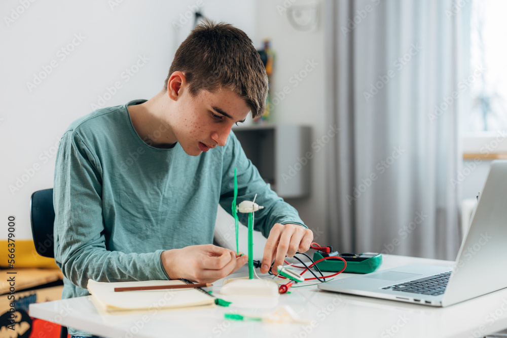 High school student is doing a science project High school student is doing a science project