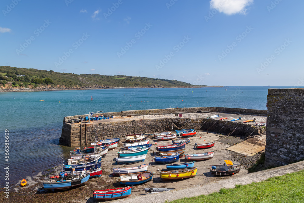 Harbor by the sea with small colorful fishing boats in the fishing village Coverack, Cornwall.