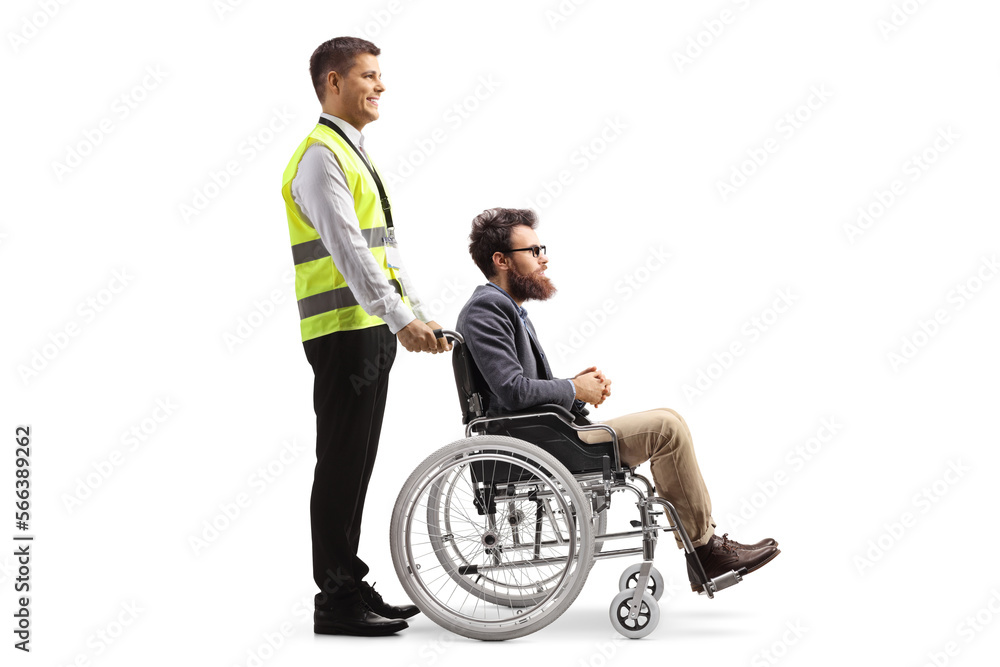 Full length profile shot of a special assitance airport worker with a male passenger in a wheelchair Full length profile shot of a special assitance airport worker with a male passenger in a wheelchair