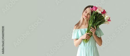 Pretty young woman with bou...