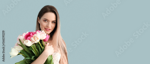 Pretty young woman with bou...