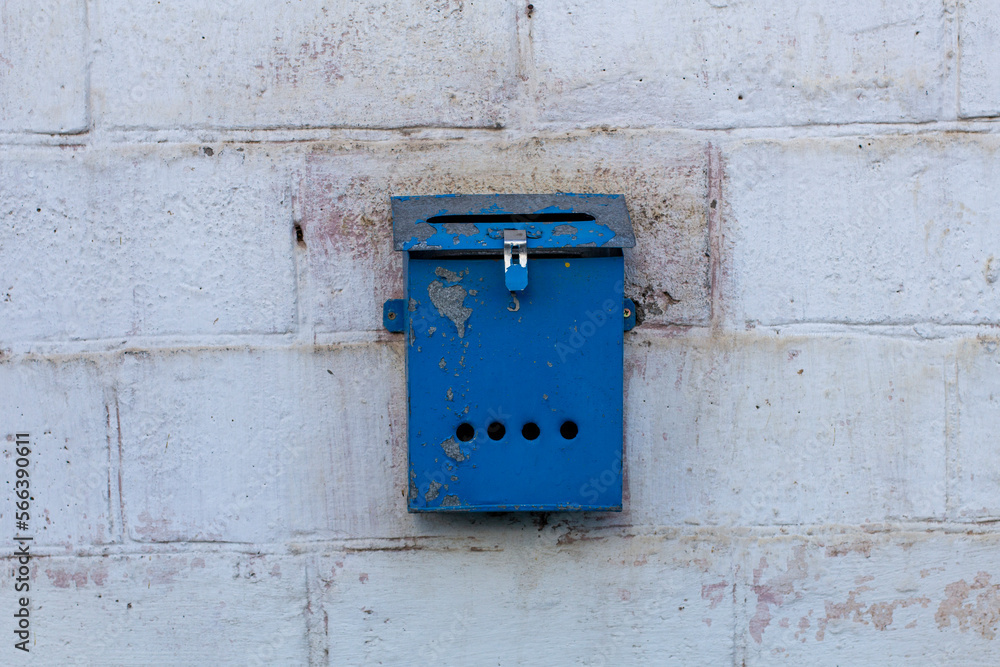 Mailbox blue in retro style on brick wall. old iron mailbox Mailbox blue in retro style on brick wall. old iron mailbox
