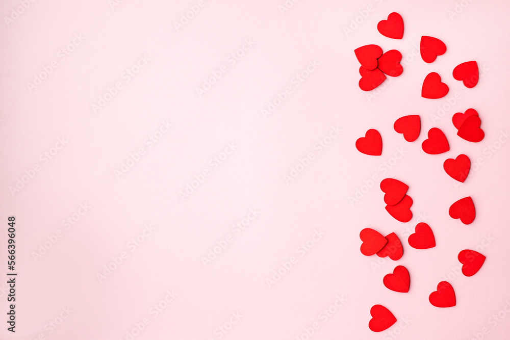 Valentine's Day background. Red hearts on pink background. Valentines day concept. Flat lay, top view, copy space