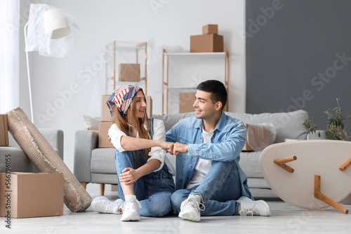 Young couple bumping fists ...