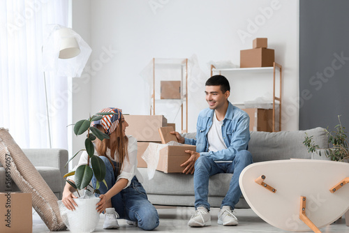 Young couple packing things...