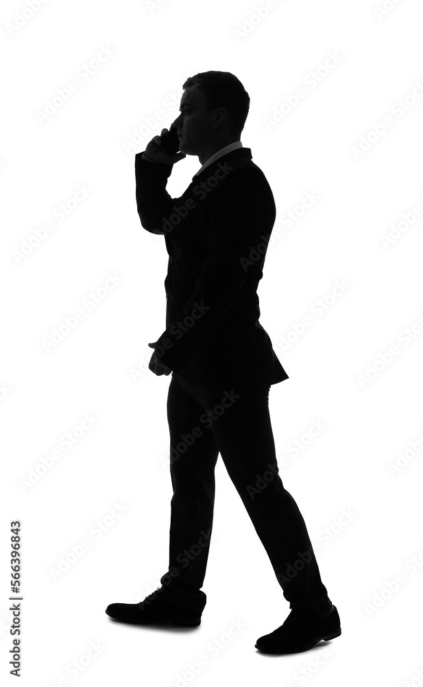 Silhouette of businessman talking by mobile phone on white background