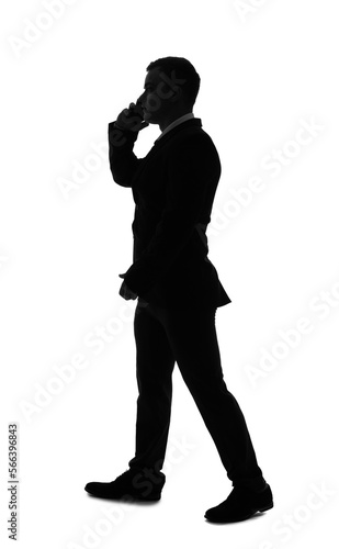 Silhouette of businessman talking by mobile phone on white background