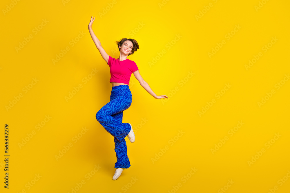 Full length photo of overjoyed cheerful lady wear pink bright clothes have fun good mood empty space isolated on yellow color background