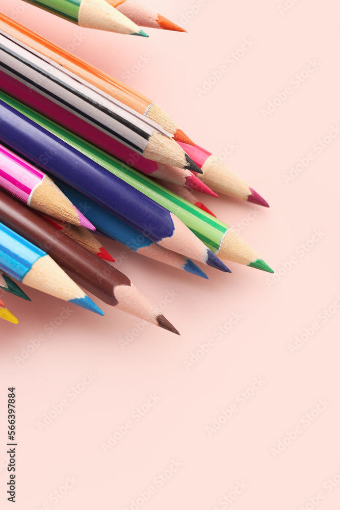 Set of colorful pencils on pink table, closeup Set of colorful pencils on pink table, closeup