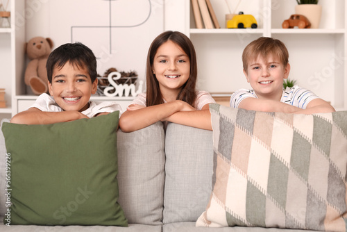 Little friends near sofa at...
