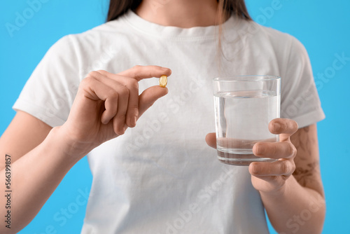 Young woman with glass of w...
