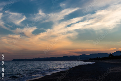 sky with clouds at sunset with the sea and the beach 