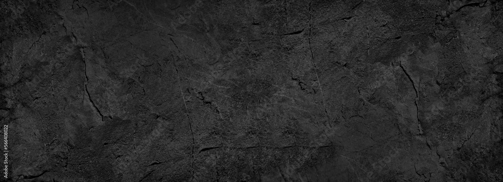 Black white stone texture. Rock surface. Close-up. Like a old rough concrete wall. Dark gray grunge background with space for design. Template. Backdrop. Wide banner. Panoramic.