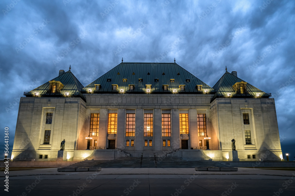 Supreme Court of Canada building in the evening under dark stormy sky