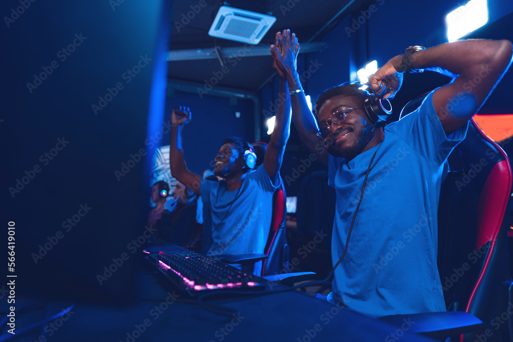 African American support Team professional gamer playing winning tournaments online games computer African American support Team professional gamer playing winning tournaments online games computer