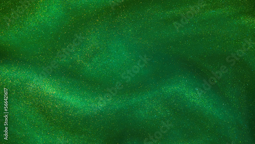 Abstract green background with golden sparkles. Photo of a green liquid with different depth of field and gold glitters. Different shades of green with golden splashes.