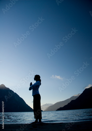 A woman practices yoga Futaleufu, Chile. photo