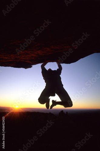 A climber bouldering at sunset, Moab, Utah.