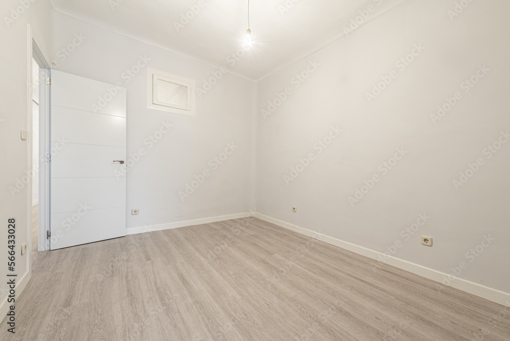 empty room with light stoneware floors, white joinery on skirting boards and doors and a small window on the wall empty room with light stoneware floors, white joinery on skirting boards and doors and a small window on the wall