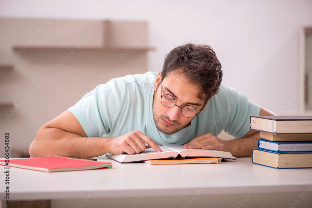 Young male student preparing for exams at home Young male student preparing for exams at home