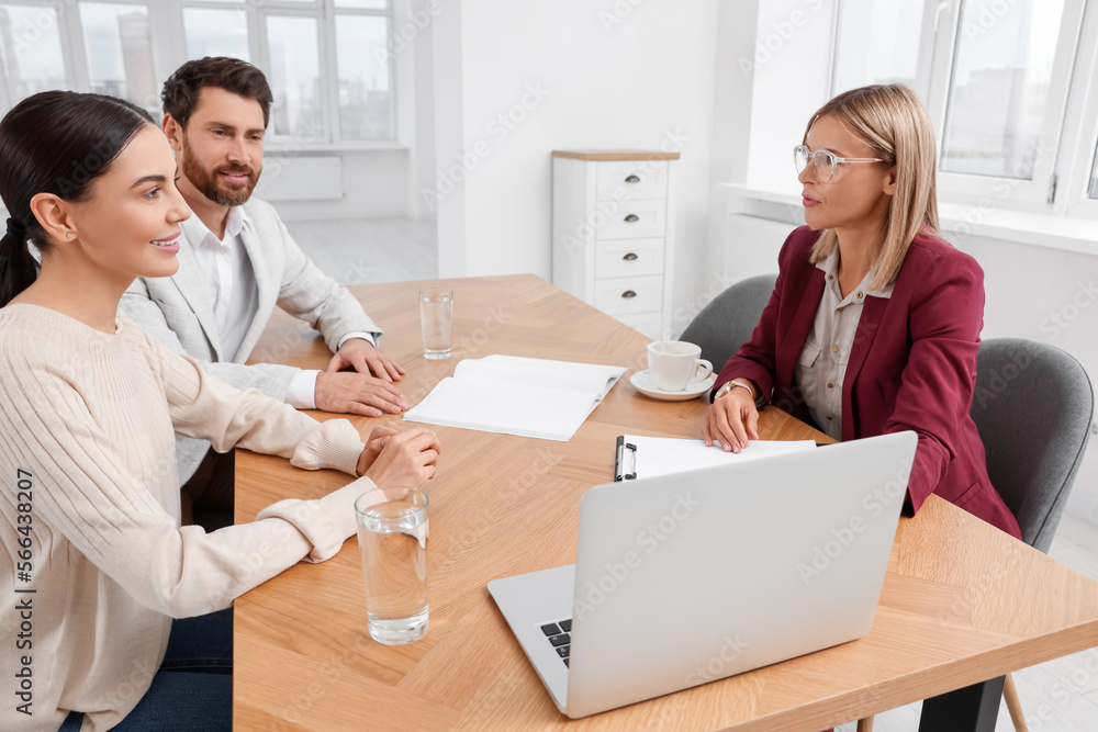 Real estate agent working with couple in new apartment Real estate agent working with couple in new apartment