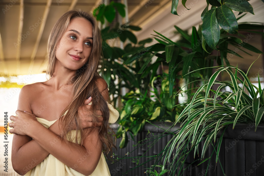 Beautiful young woman sitting on indoor terrace Beautiful young woman sitting on indoor terrace