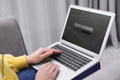 Woman unlocking laptop with blocked screen indoors, closeup