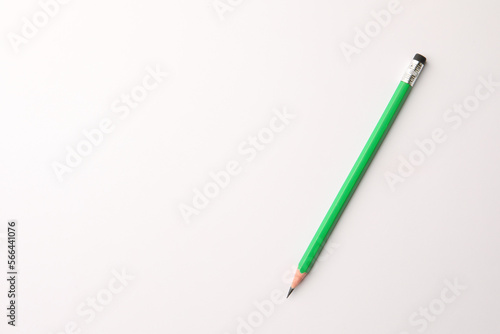 Sharp graphite pencil with eraser on white background, top view. Space for text