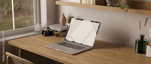 side view of minimal Scandinavian home workspace with laptop mockup on wood table