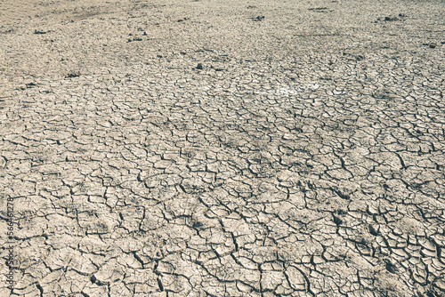 Landscape ground cracks drought crisis environment background.