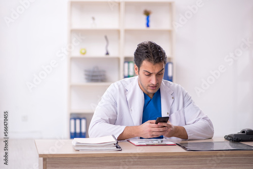 Young male doctor in telemedicine concept © Elnur