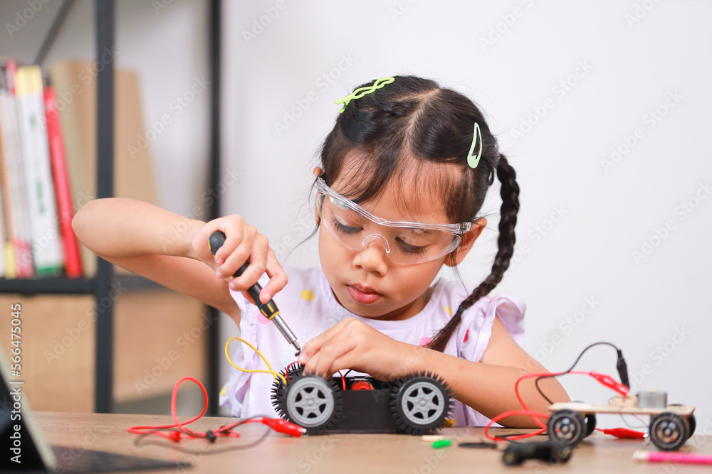 custom made wallpaper toronto digitalAsian little girl students learn at home by coding robot cars in STEM, STEAM, mathematics engineering science technology computer code in robotics for kids' concepts.