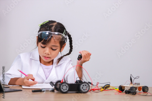 Wallpaper Mural Asian little girl students learn at home by coding robot cars in STEM, STEAM, mathematics engineering science technology computer code in robotics for kids' concepts. Torontodigital.ca