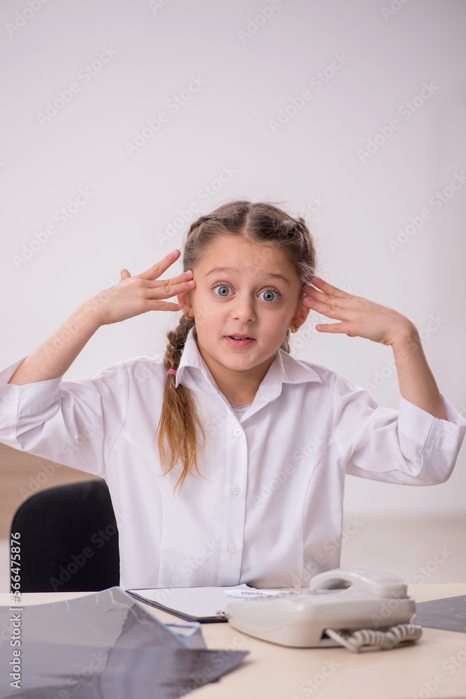 Small girl playing doctor radiologist in the clinic Small girl playing doctor radiologist in the clinic