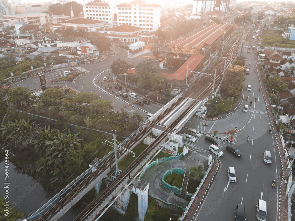 Fototapeta premium Aerial traffic with in railway bridge in Yogyakarta City. Yogyakarta, Indonesia - January, 2023.