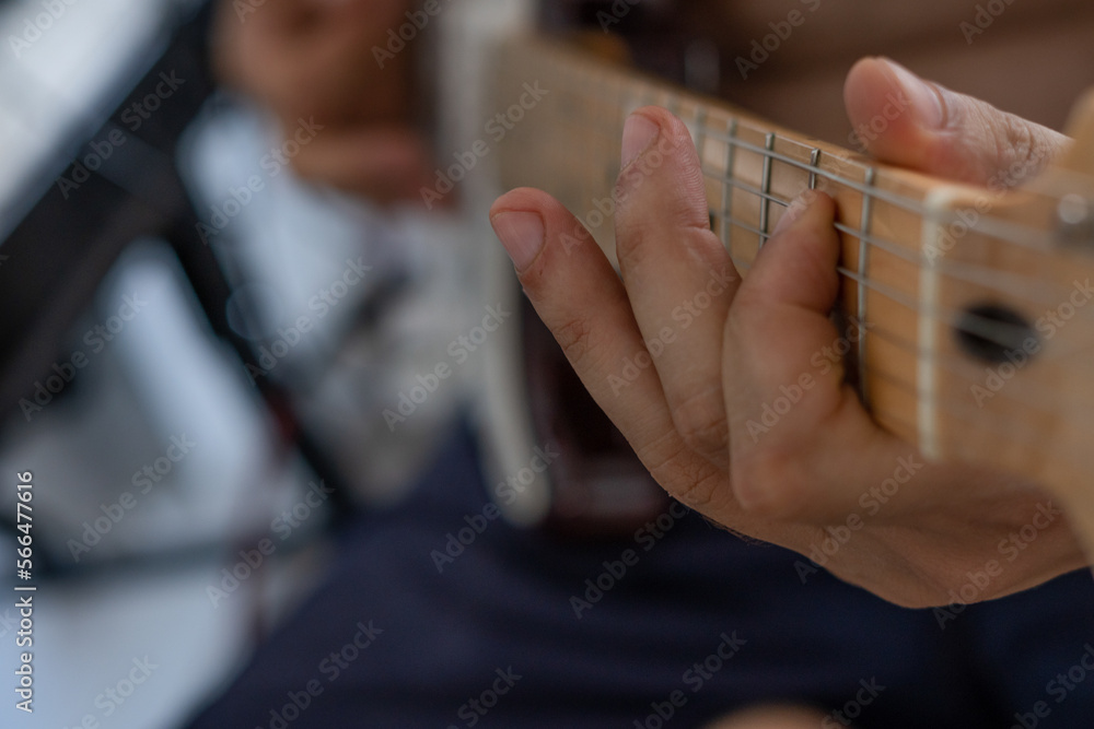 young man playing guitar young man playing guitar