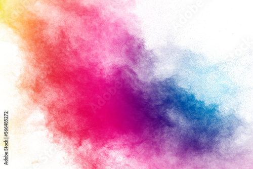 Freeze motion of color powder exploding on white background.