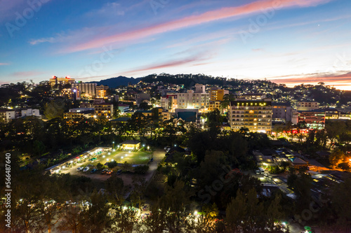 Baguio City, Philippines - Evening aerial of Burnham Park and surrounding hotels.